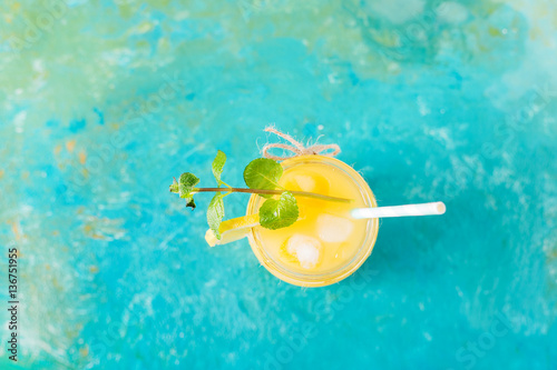 Orange juice. Orange smoothie on a turquoise background..Kiwi. Cocktails. Detox Juice. Summer drink. Healthy food concept