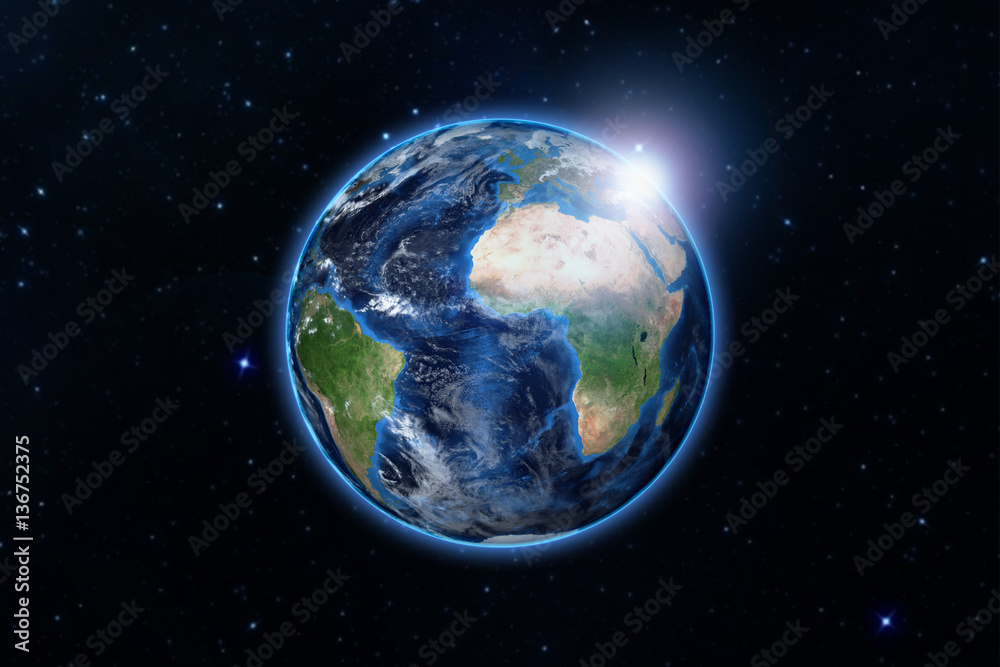 Fototapeta premium blue planet earth from space showing America and Africa, USA, globe world with blue glow edge and sun light sunrise on space in a star field