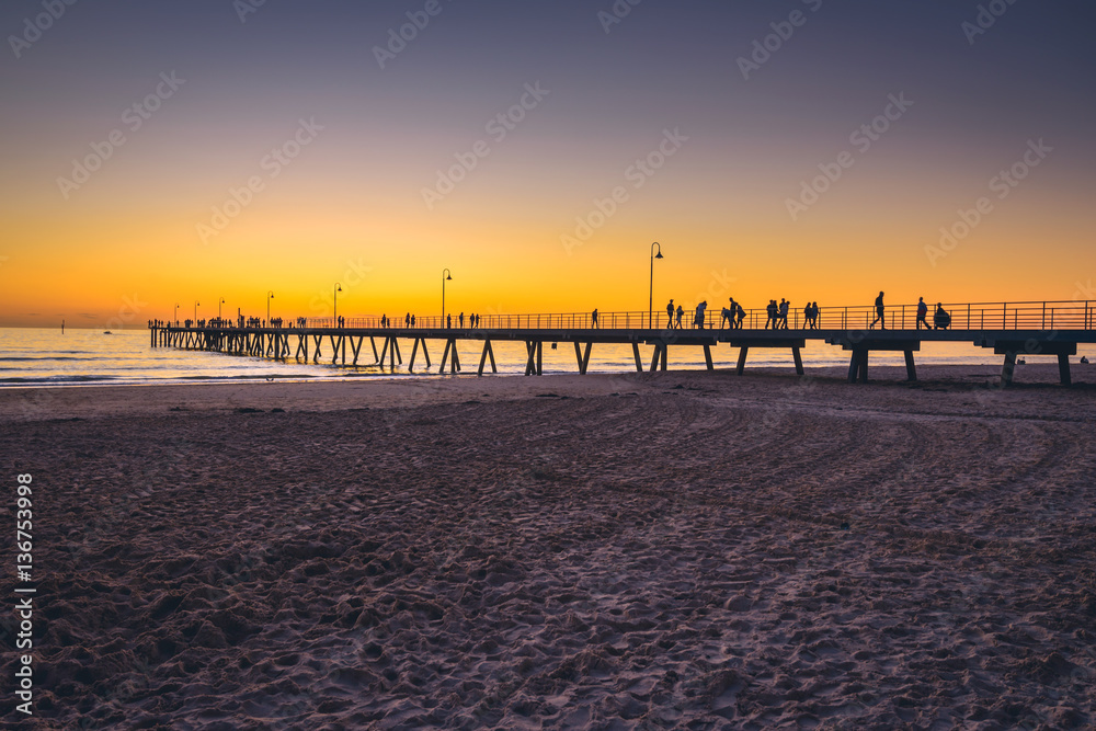 Fototapeta premium People walking on pier