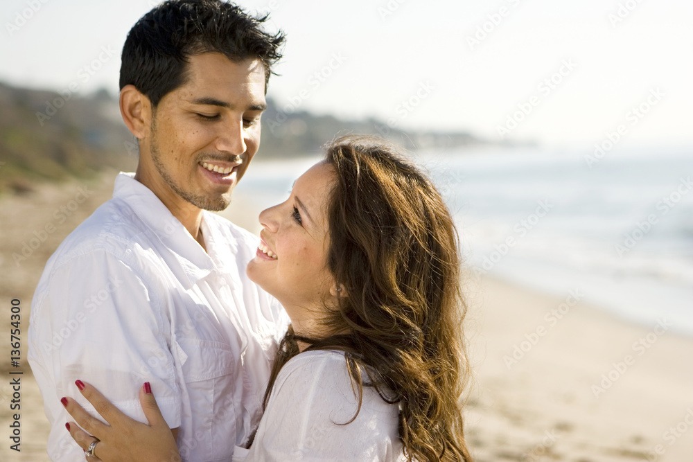 Fototapeta premium Beautiful Hispanic couple laughing and smiling.