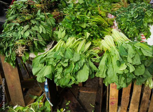 Various kind of green vegetables sold at Bogor traditional market photo taken in Indonesia