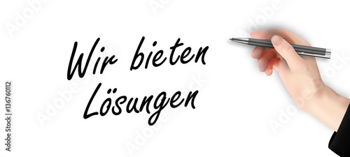 Wir bieten Lösungen - Hand schreibt Text