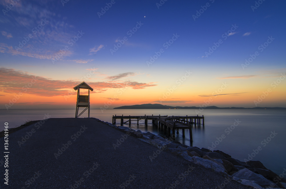 Sunrise of sea and wood bridge