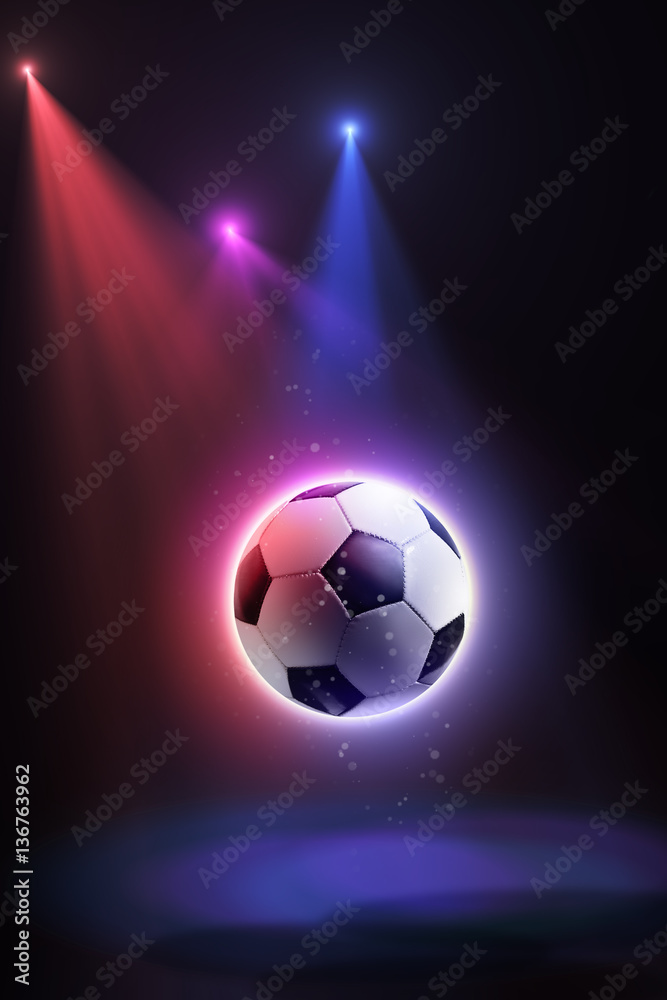 Soccer ball, floating in space and illuminated by the rays on an abstract background