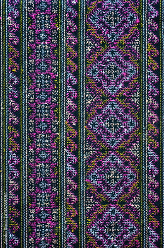 Colorful thai silk handcraft peruvian style rug surface close up More this motif & more textiles peruvian stripe beautiful background tapestry persian nomad detail pattern farabic fashionable textile. photo