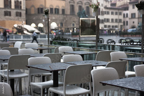 RESTAUTANT TABLES DURING RAIN ON PIAZZA DELLA SIGNORIA, FLORENCE, ITALY