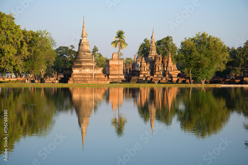 Ruins of ancient Buddhist temples in the light of the evening sun. Sukhothai, Thailand