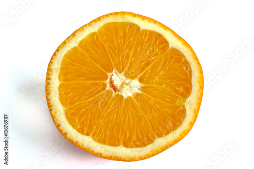 Closeup of an orange half on a white background