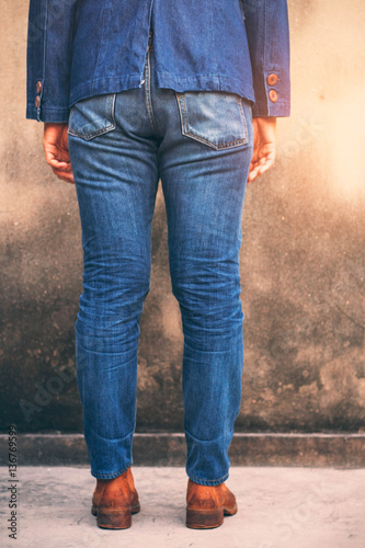 Woman with fashion blue jeans.