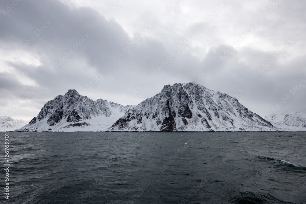 Gray cloudy mountains in svalbard
