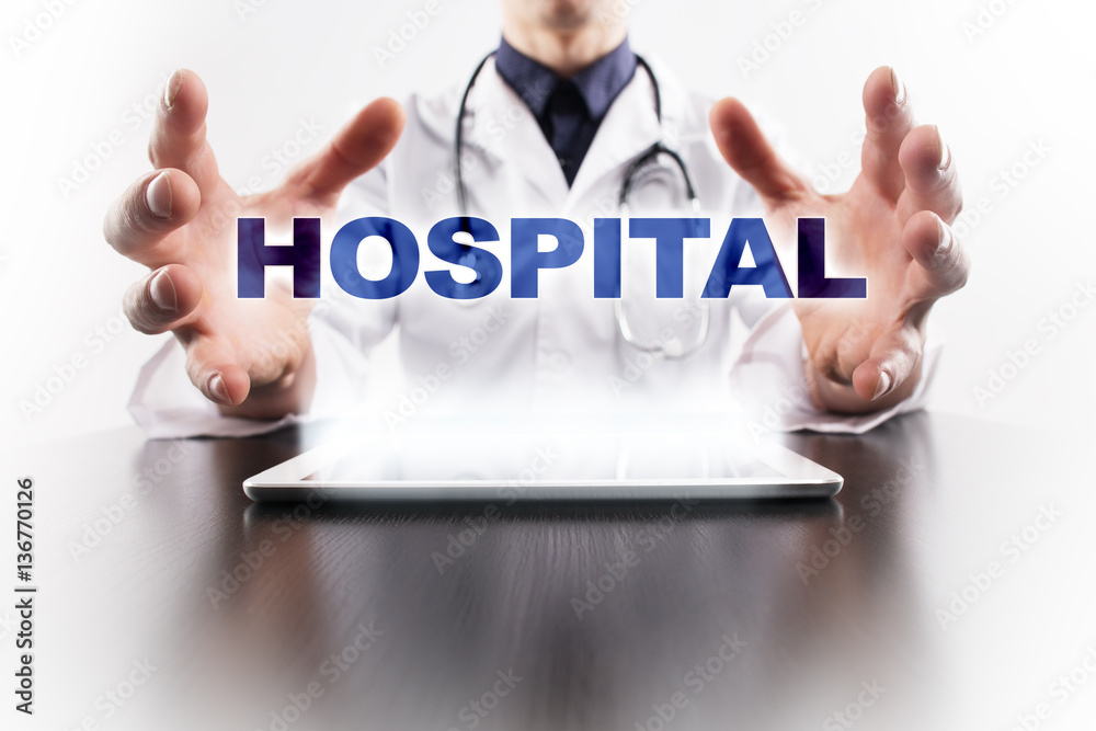Medical doctor using tablet PC with hospital medical concept. Medical doctor using tablet PC with hospital medical concept.