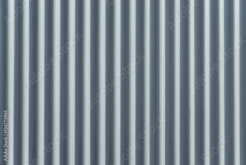 Corrugated metal sheet. Bluish background pattern.