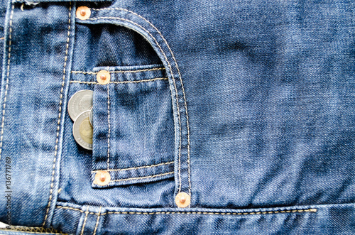Close up Money in Front Pocket of Blue Jeans as Background Composition.