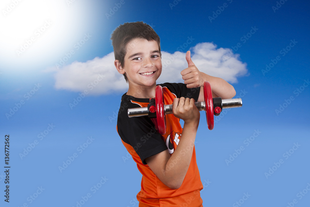© carballo - child exercising with dumbbells © carballo - child exercising with dumbbells