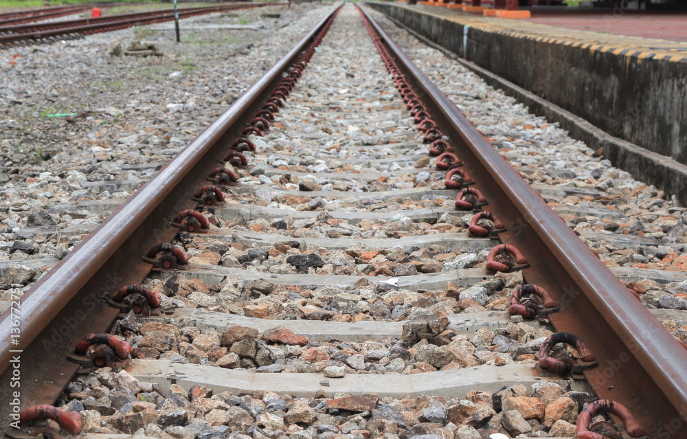 Naklejka premium railway track on gravel with concrete rail ties