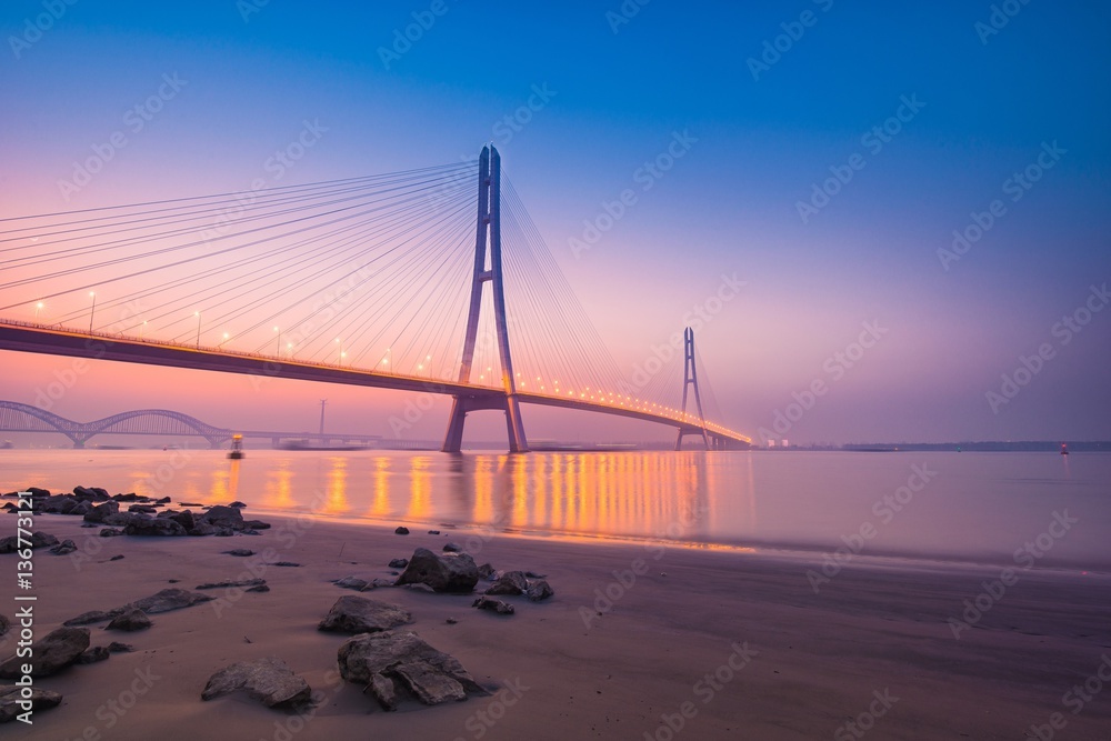 Sunset at The River Spanning Bridge Over The Yangtze River in Nanjing City