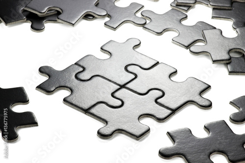 pieces of a jigsaw puzzle isolated on white background