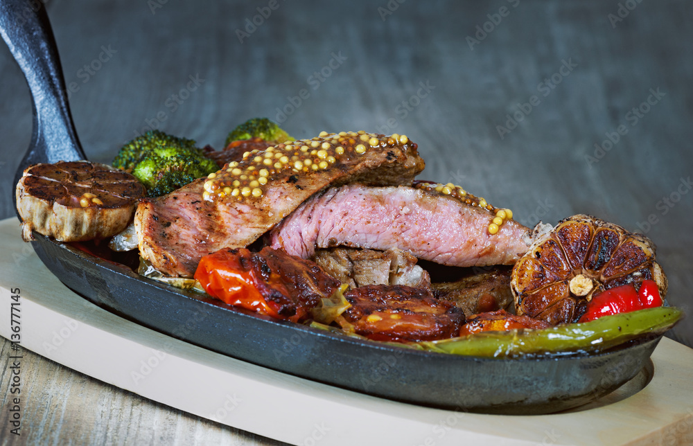 Beef tenderloin with blood on the grill with vegetables Beef tenderloin with blood on the grill with vegetables