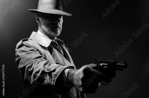 Spy agent pointing a gun