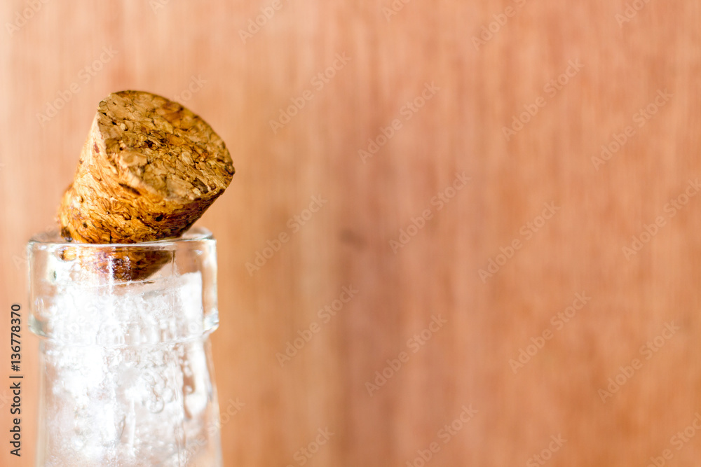 Cold ice bottle on blur wood background or backdrop Cold ice bottle on blur wood background or backdrop