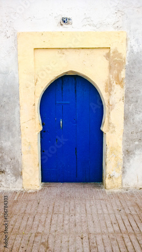 Simple traditional blue Moroccan door, Essaouira, Morocco © Luoxi