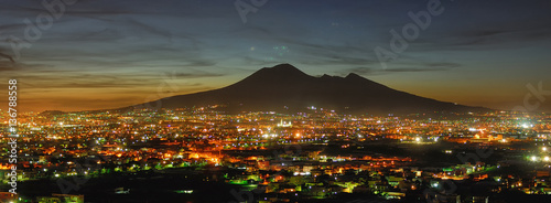 Naples, Campania, Italy. View of the bay by night and Mount Vesuvius Volcano in background photo