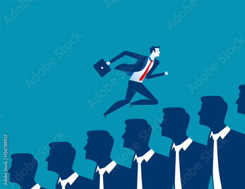 Businessman running over other business people