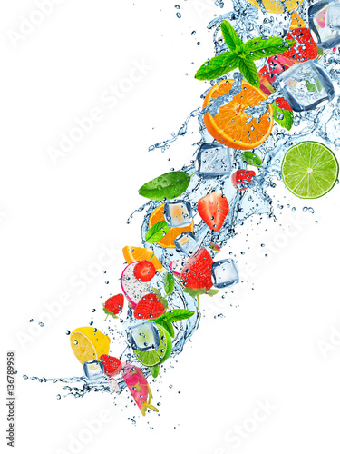 Fresh fruits falling in wat...