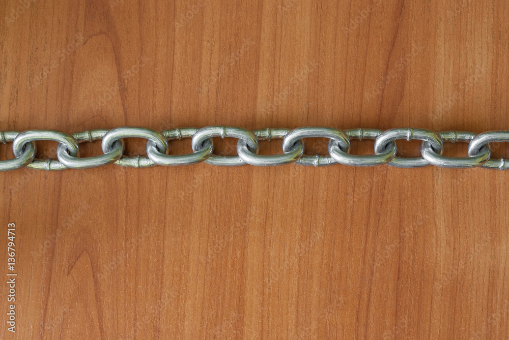 Chains on wood background