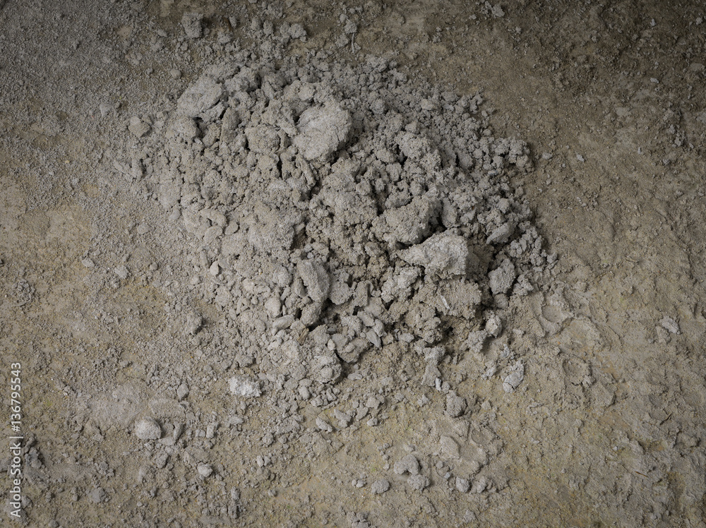 midden of cement on concrete floor at construction site midden of cement on concrete floor at construction site