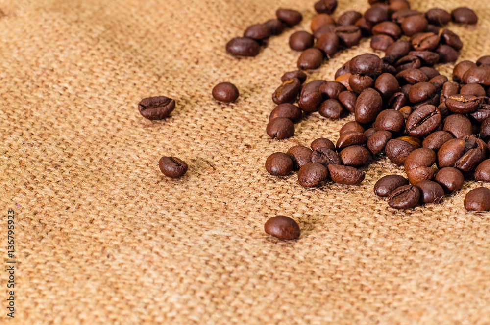 coffee beans on burlap background coffee beans on burlap background