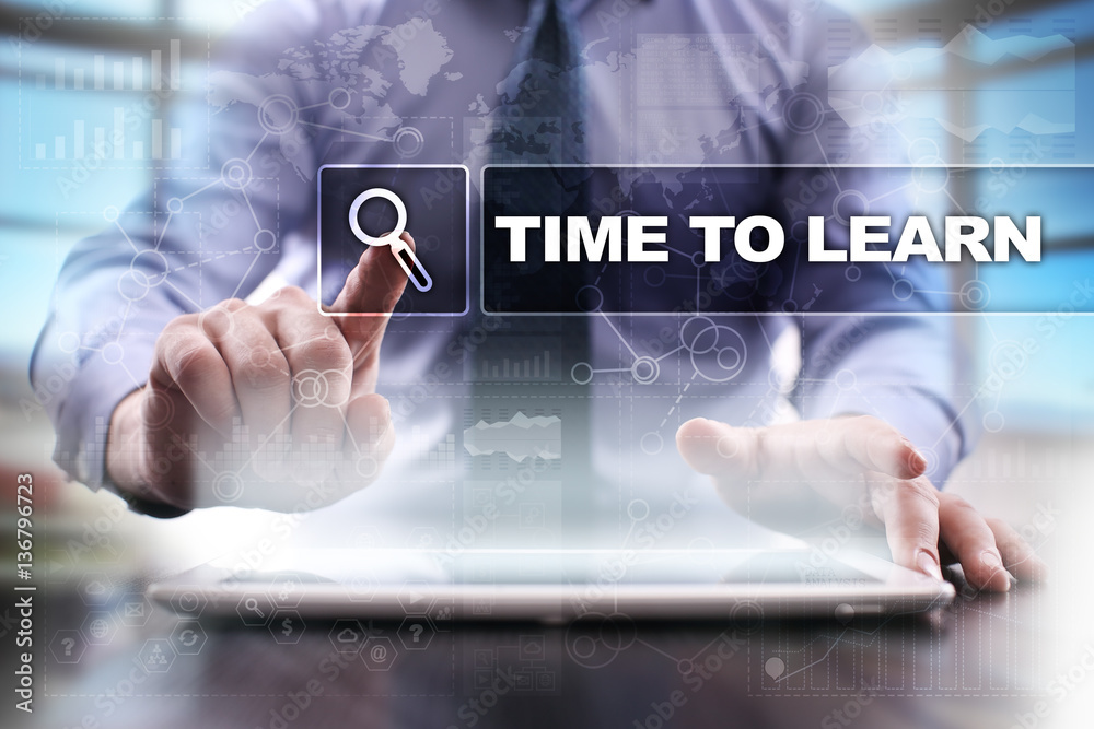 Fototapeta premium Businessman using tablet pc and selecting time to learn.