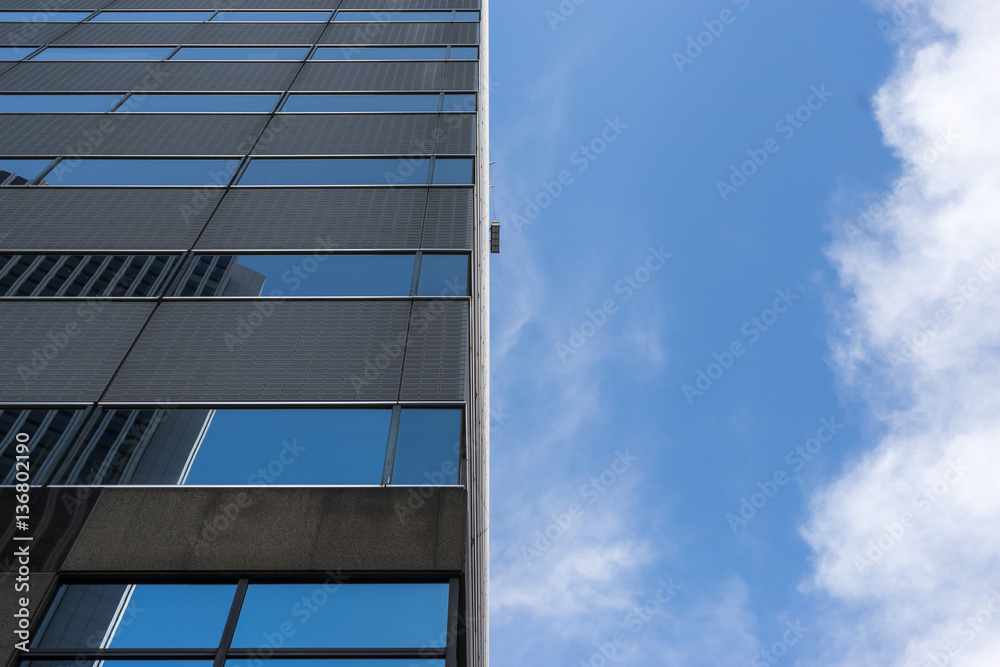Worker Cleaning Office Tower Windows Worker Cleaning Office Tower Windows