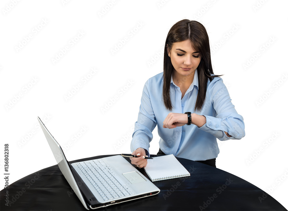 Cute businesswoman is looking at wristwatch at his workplace in the office. White isolated background. Cute businesswoman is looking at wristwatch at his workplace in the office. White isolated background.