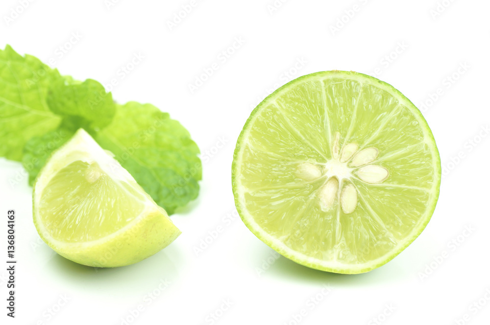green lemon slice isolated on white background