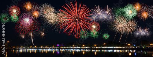 Reflecting on the water surface, work a fireworks display to celebrate great day.