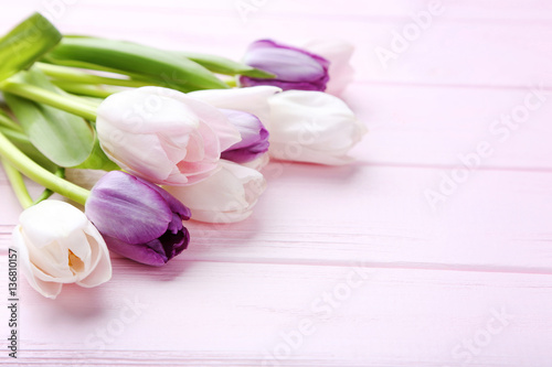 Fototapeta Naklejka Na Ścianę i Meble -  Bouquet of tulips on pink wooden table