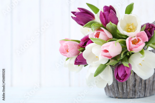 Fototapeta Naklejka Na Ścianę i Meble -  Bouquet of tulips on a wall paneling background