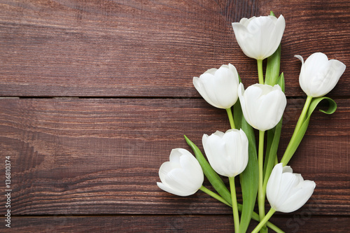 Fototapeta Naklejka Na Ścianę i Meble -  Bouquet of tulips on brown wooden table