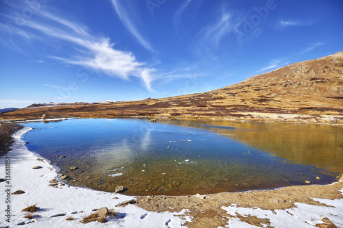 Independence Pass mountain landscape with lake and blue sky, continental divide in Colorado, USA.