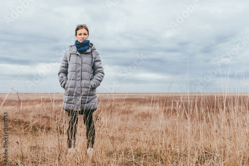 Woman standing on a meadow © kerkezz