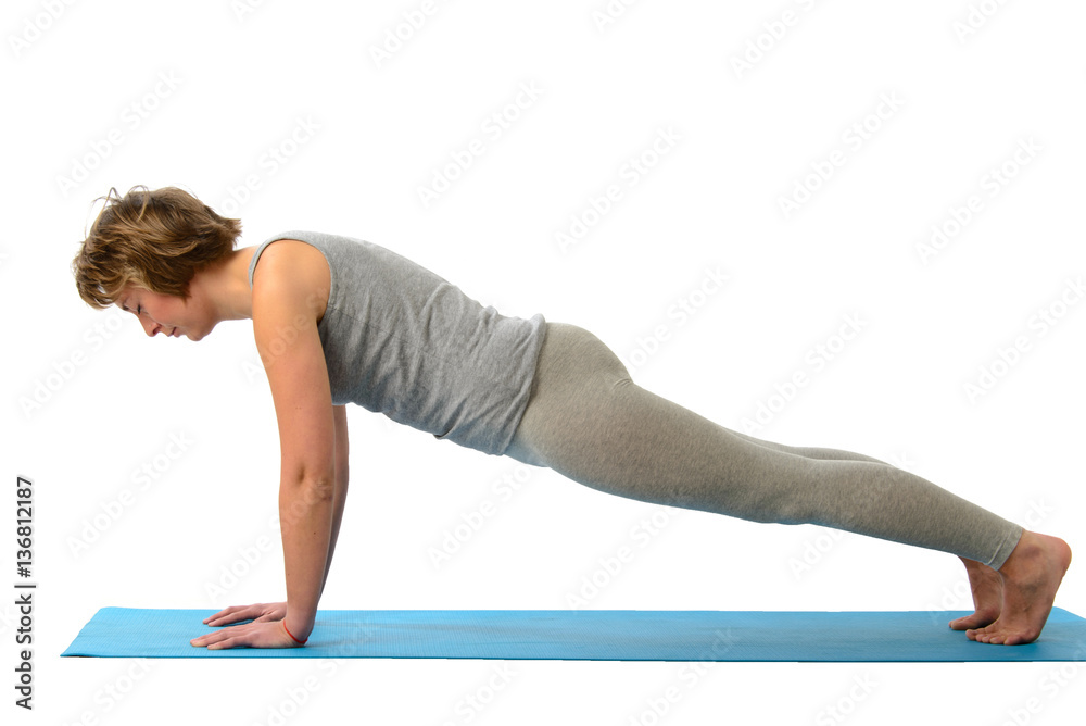 Young yoga woman engaged in yoga. Isolated on white background Young yoga woman engaged in yoga. Isolated on white background