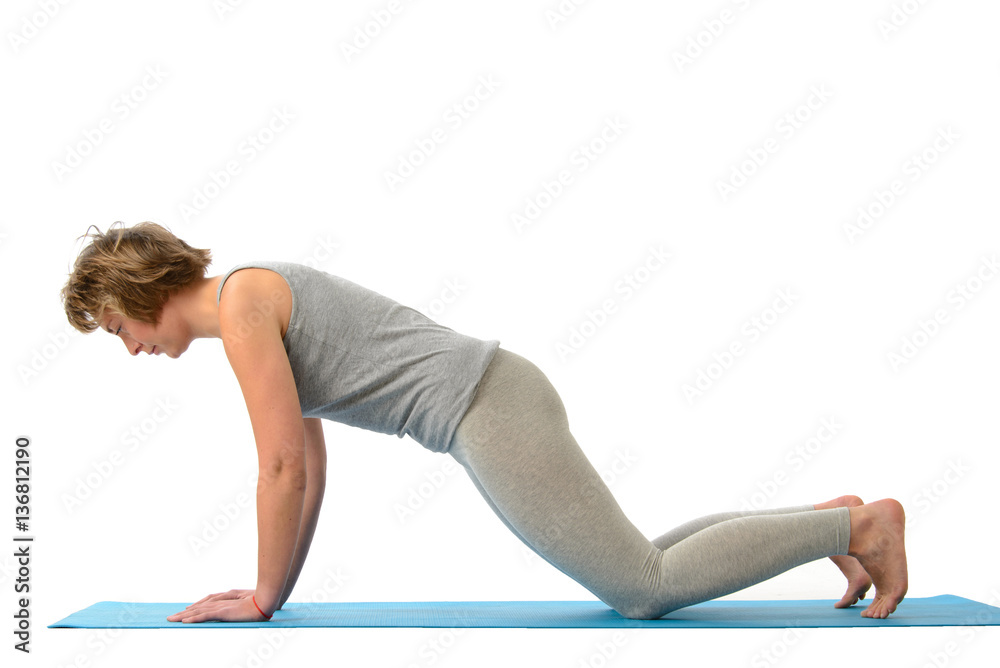 Young yoga woman engaged in yoga. Isolated on white background Young yoga woman engaged in yoga. Isolated on white background
