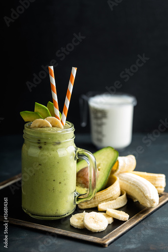 Fresh blended Banana and avocado smoothie with yogurt or milk in mason jar, healthy eating, superfood