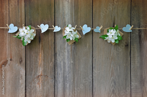 Hearts and blossoming apple on wooden background. Love. Spring.