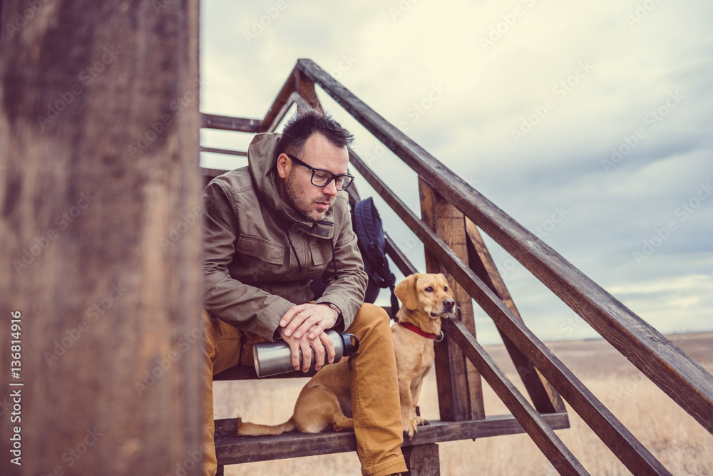 Hiker and dog resting Hiker and dog resting