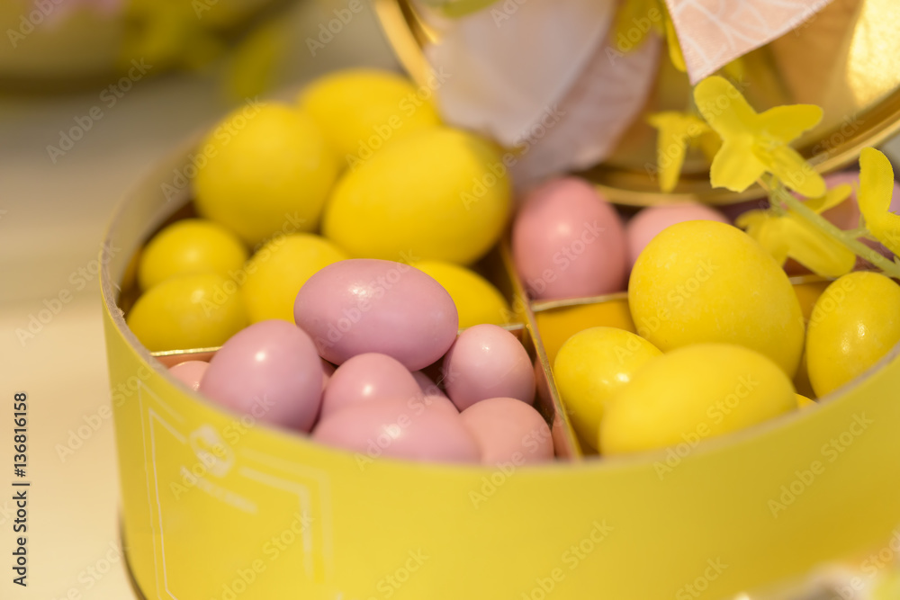 delicious chocolate eggs colored pink and yellow in their container delicious chocolate eggs colored pink and yellow in their container