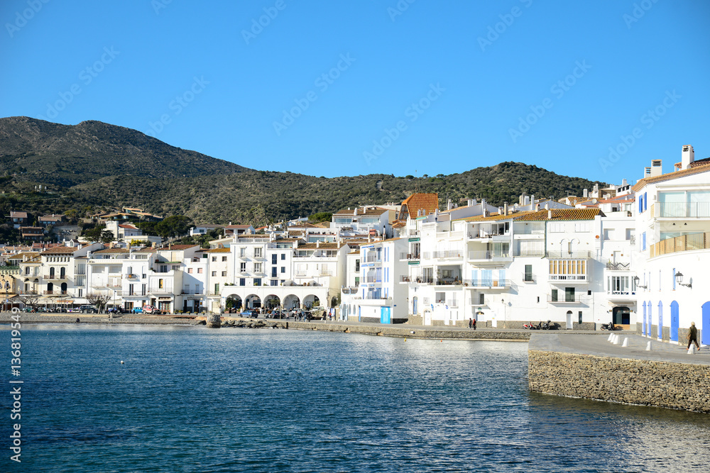cityscape of Dali famous landmark spanish village Cadaques port on blue mediterranean sea sunny day