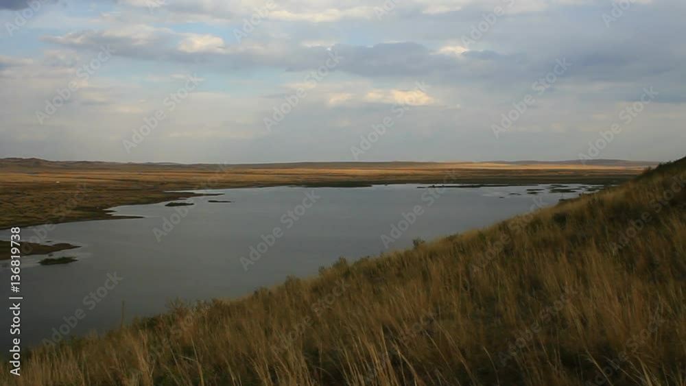 autumnal steppe and lake in Xilingol, China. autumnal steppe and lake in Xilingol, China.