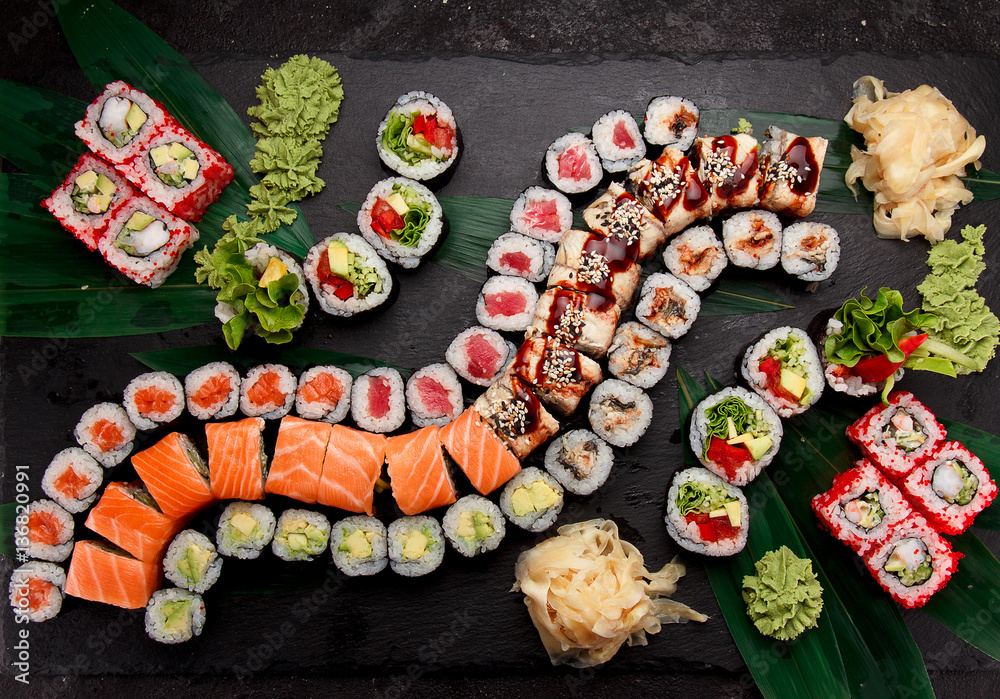 Japanese cuisine. Sushi on a stone plate. Japanese cuisine. Sushi on a stone plate.